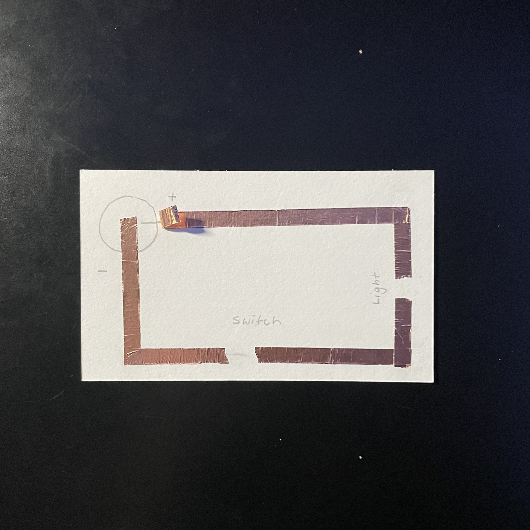 This is the second circuit that was created it also uses the copper tape as a conductor, but with this circuit it uses a sort of switch method, the first image contains the tape and drawn out circuit